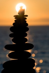 Balanced caryn at the beach during sunset.